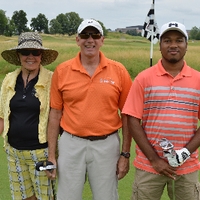 A golf team of 3 alumni.